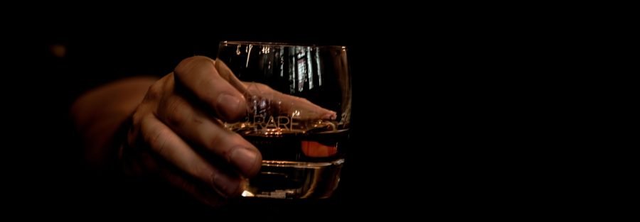 man holding a glass