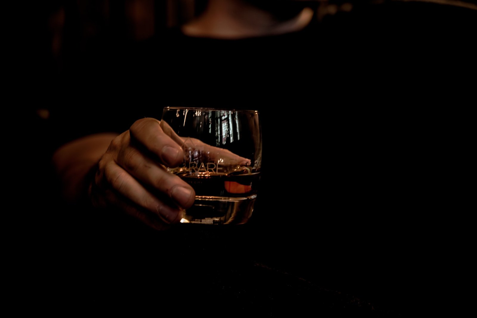 man holding a glass